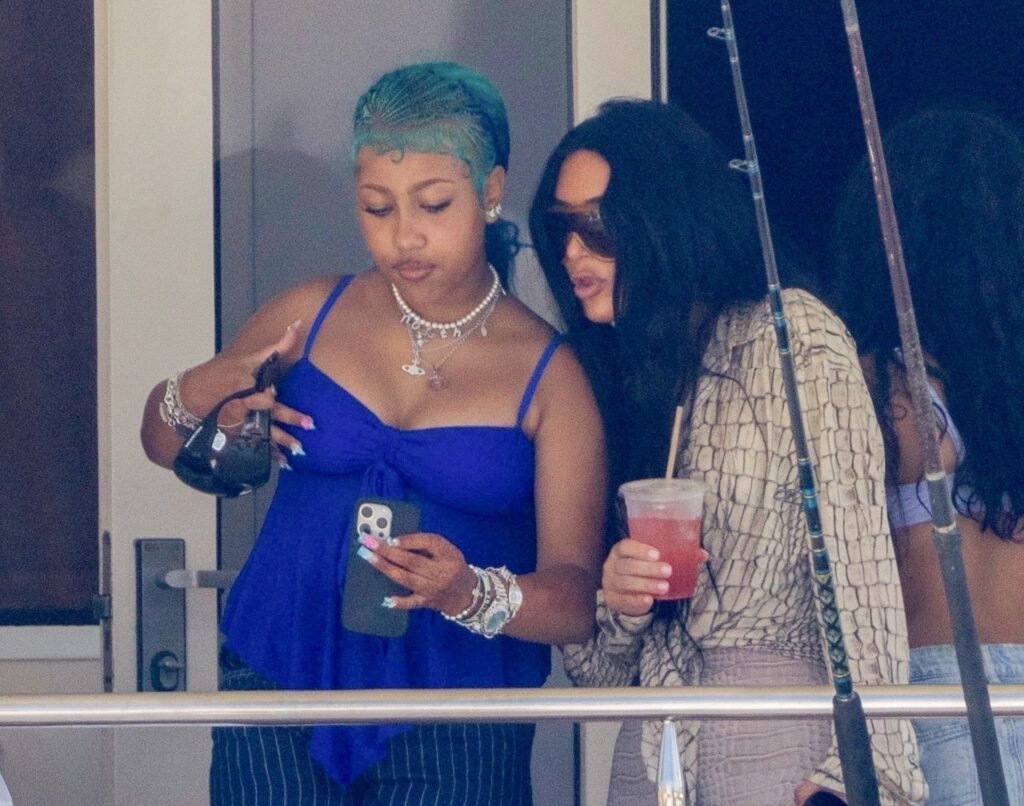 Kim Kardashian Makes Waves in Acne Snake Print Top and Skims Crocodile Bikini Top and Capris During Luxurious Yacht Getaway with North West